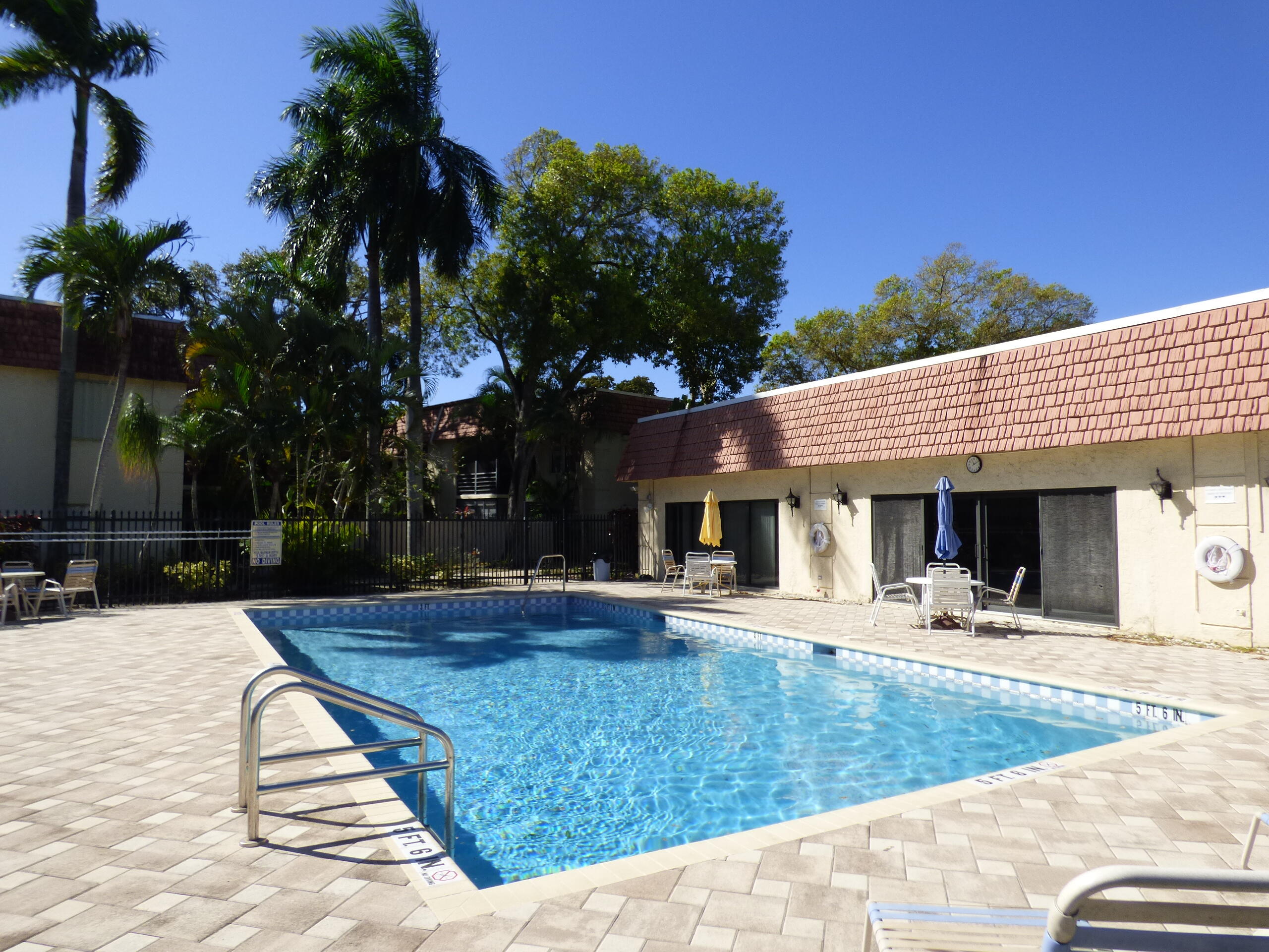 132 South Cypress Road, Unit 514 Pompano Beach, FL 33060 - Photo 38 of 48 a view of a house with palm trees