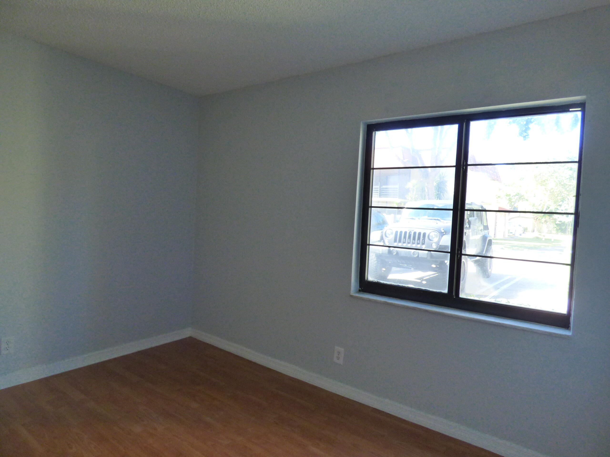 132 South Cypress Road, Unit 514 Pompano Beach, FL 33060 - Photo 10 of 48 an empty room with a window