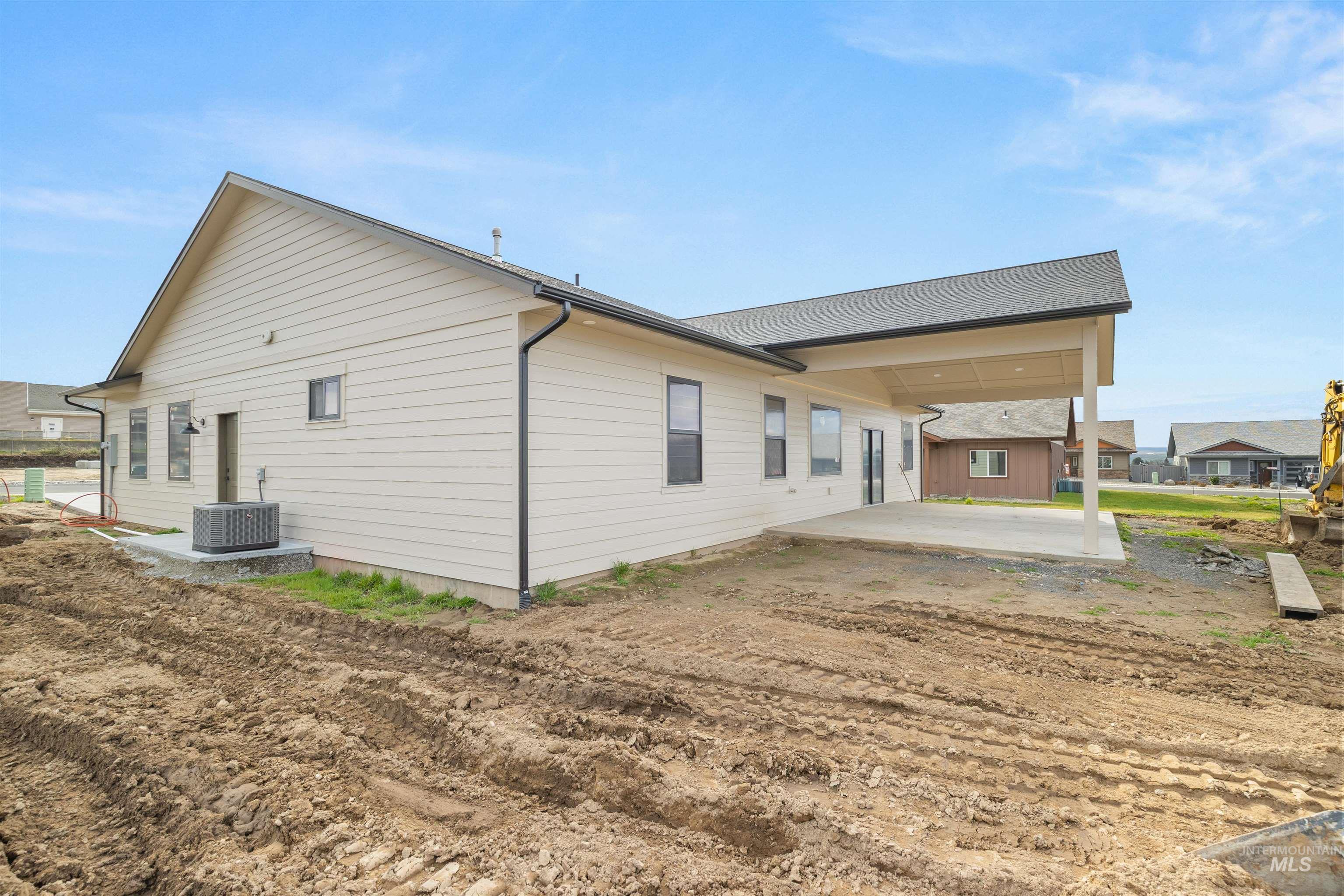335 Warner Avenue Lewiston, ID 83501 - Photo 41 of 43 View of property exterior with a patio area and a central AC unit