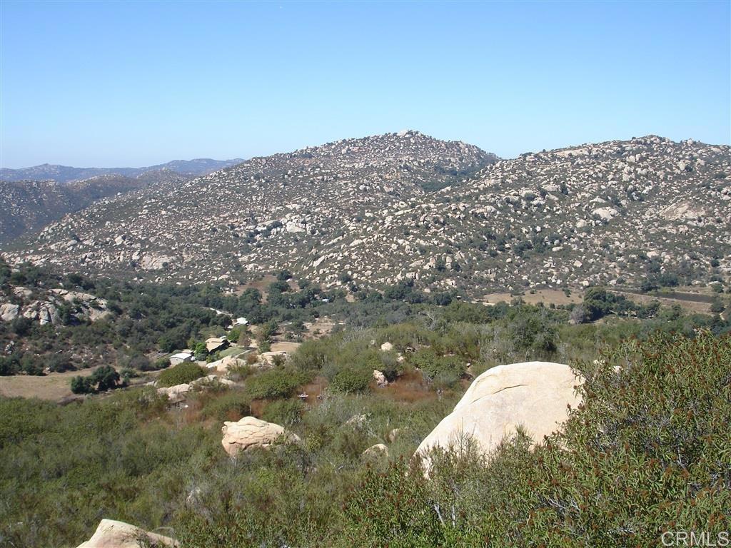 0 Old Wagon Rd Valley Center Escondido, CA 92027 - Photo 5 of 7 a view of a lake in middle of the green field