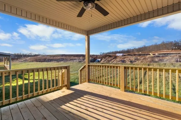 a view of a balcony with wooden floor and city view