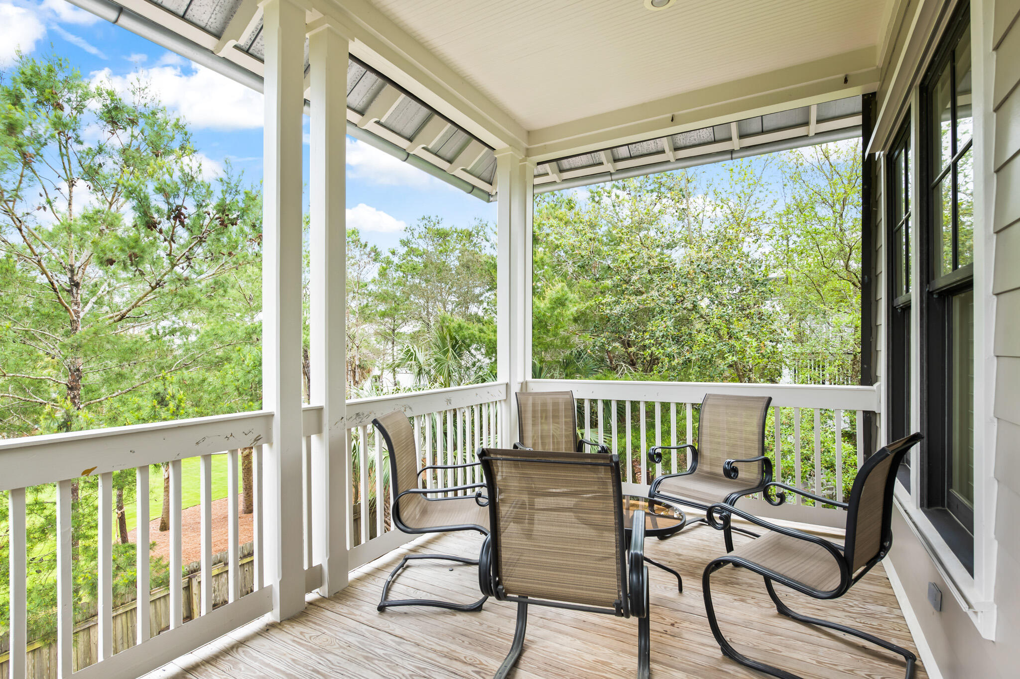70 Pine Crest Circle Inlet Beach, FL 32461 - Photo 11 of 43 a view of a chair and table in deck