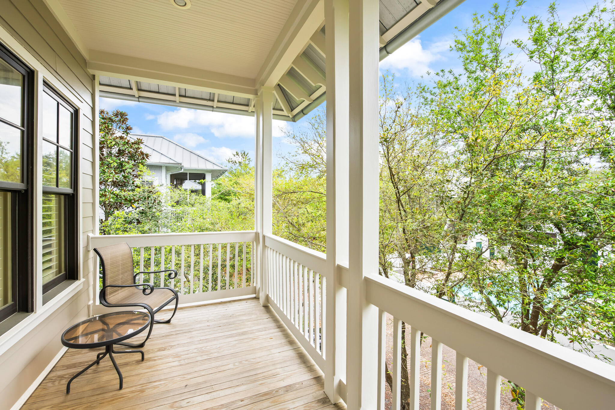 70 Pine Crest Circle Inlet Beach, FL 32461 - Photo 19 of 43 a view of balcony with wooden floor and outdoor seating
