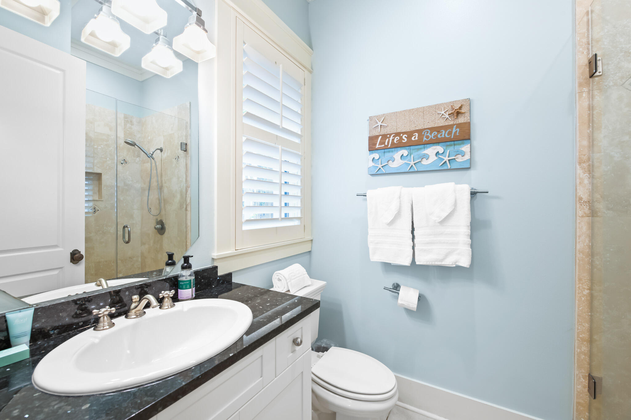 70 Pine Crest Circle Inlet Beach, FL 32461 - Photo 26 of 43 a bathroom with a toilet a sink and mirror