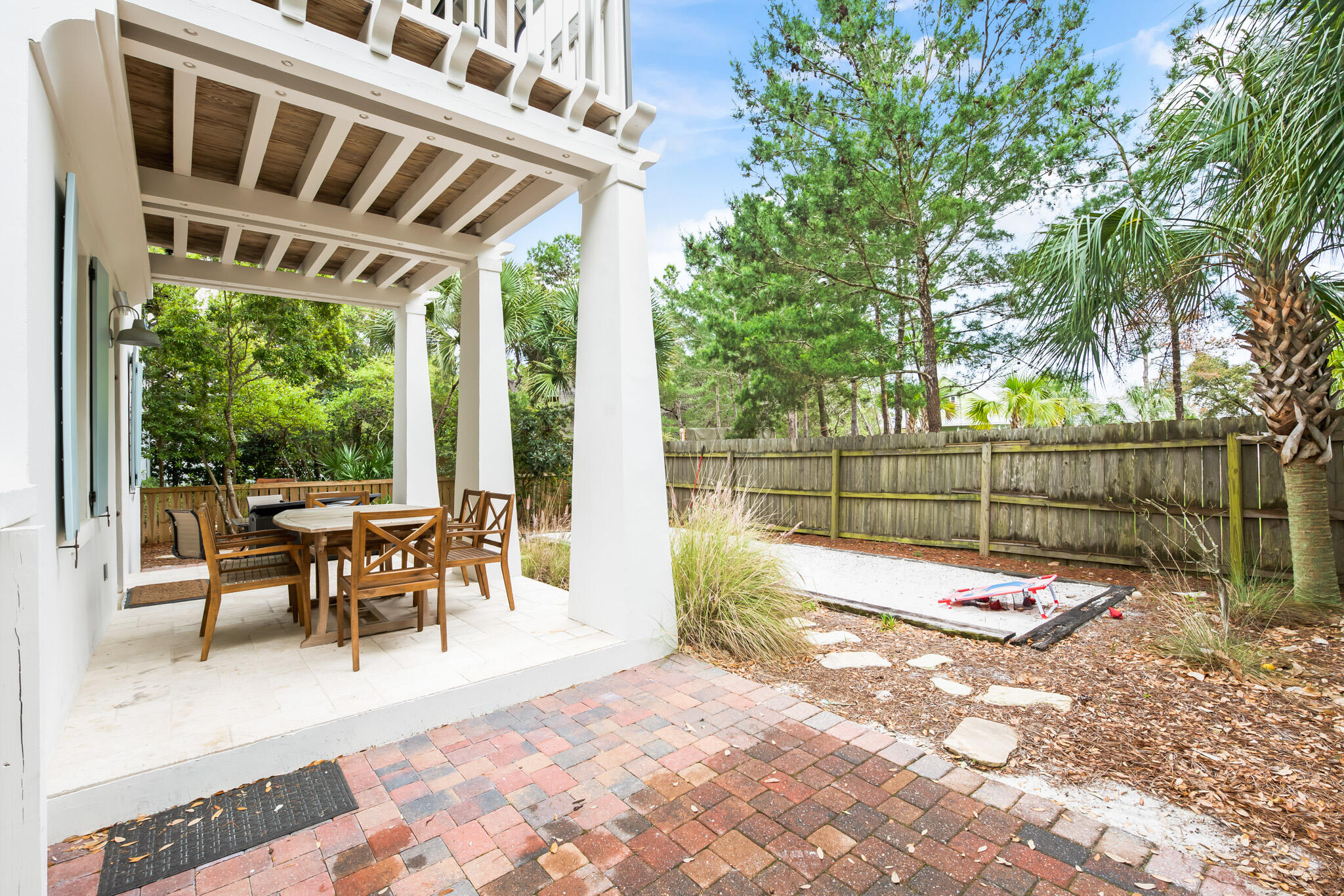 70 Pine Crest Circle Inlet Beach, FL 32461 - Photo 29 of 43 a view of a patio with wooden floor and outdoor seating