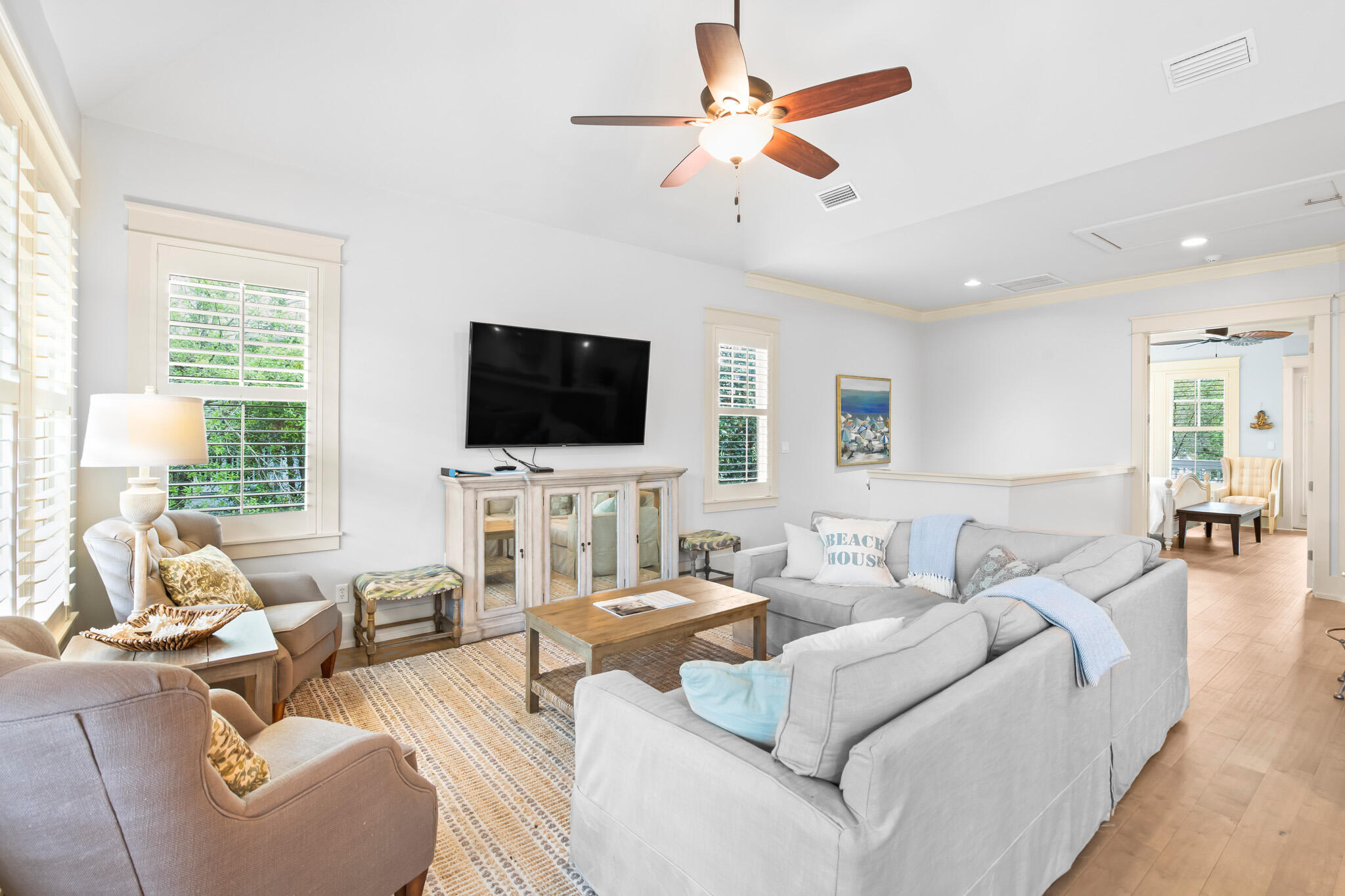 70 Pine Crest Circle Inlet Beach, FL 32461 - Photo 3 of 43 a living room with furniture a flat screen tv and a large window