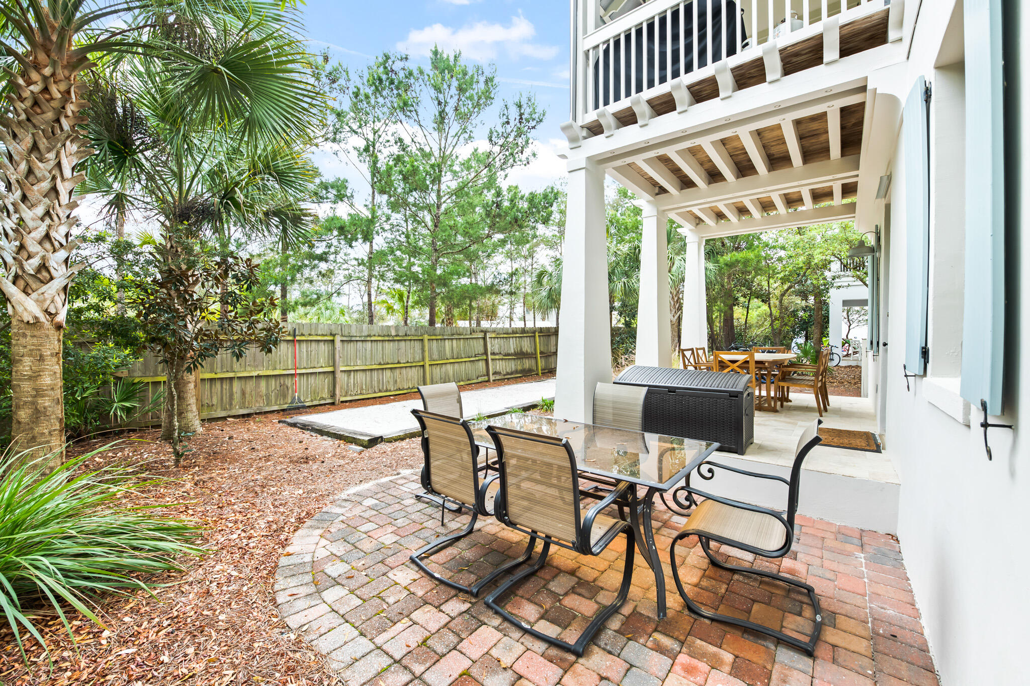 70 Pine Crest Circle Inlet Beach, FL 32461 - Photo 32 of 43 a view of a patio with a table and chairs next to a yard