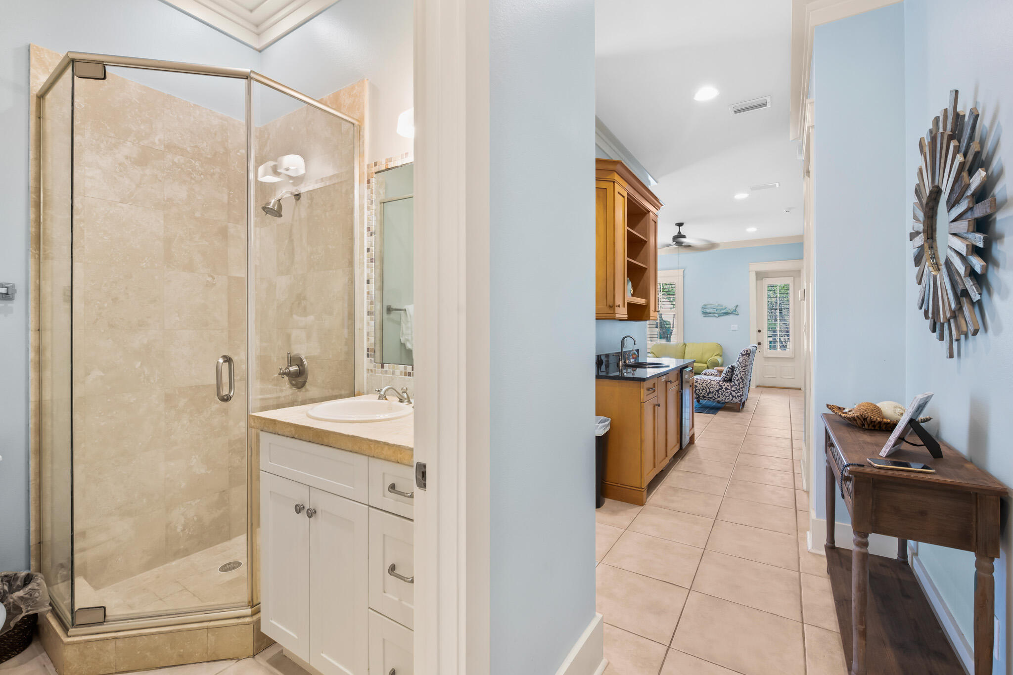 70 Pine Crest Circle Inlet Beach, FL 32461 - Photo 35 of 43 a open kitchen with a sink and dishwasher with a large kitchen island next to a window