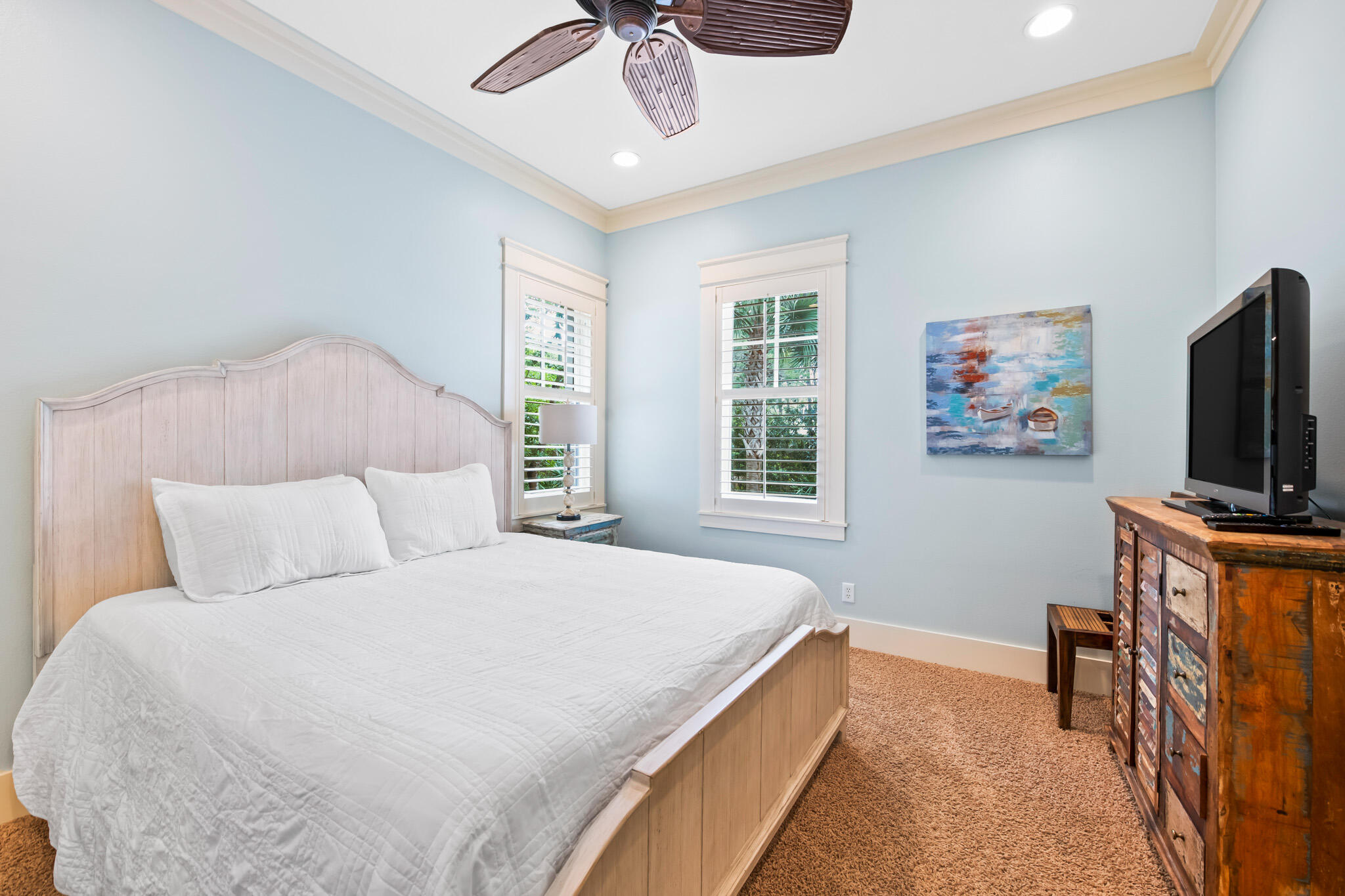 70 Pine Crest Circle Inlet Beach, FL 32461 - Photo 36 of 43 a bedroom with a large bed a flat tv screen and a dresser