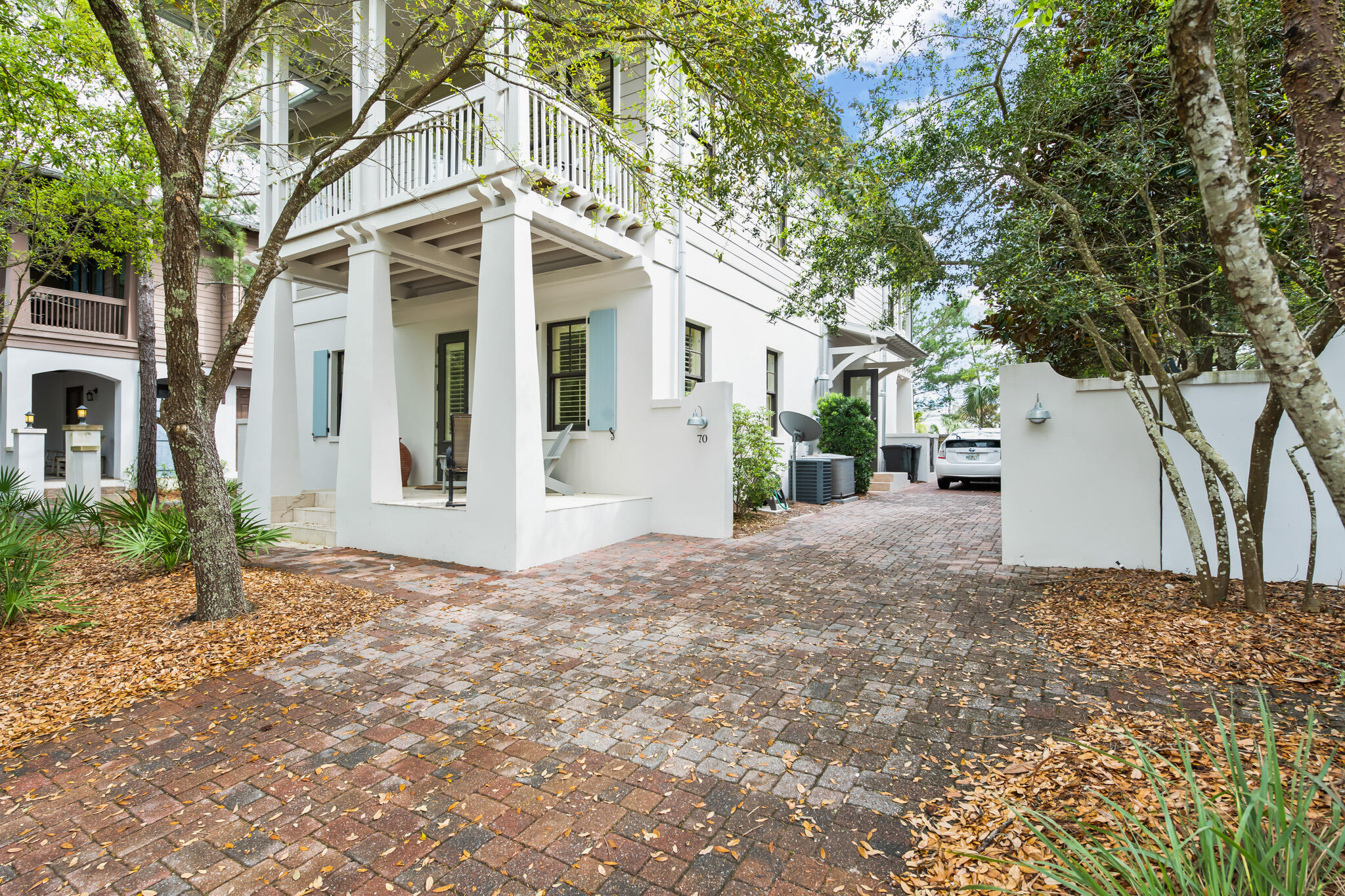 70 Pine Crest Circle Inlet Beach, FL 32461 - Photo 38 of 43 a view of a white house with a large tree