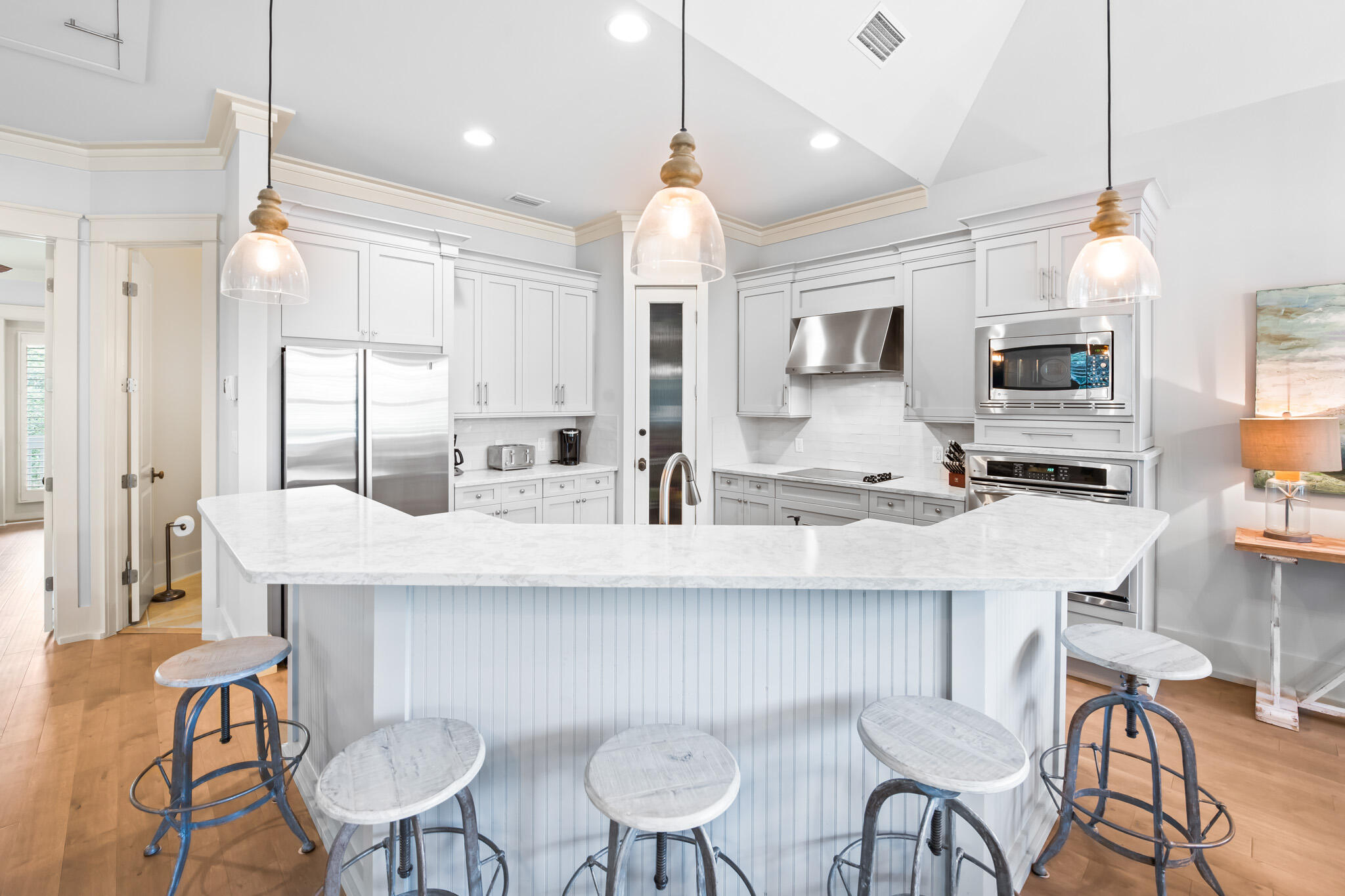 70 Pine Crest Circle Inlet Beach, FL 32461 - Photo 7 of 43 a kitchen with stainless steel appliances kitchen island granite countertop a dining table chairs and white cabinets