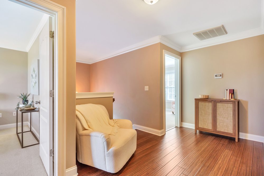 15 Fawn Hill Drive Anderson, SC 29621 - Photo 21 of 38 This inviting hallway offers polished wood flooring and bright crown molding.