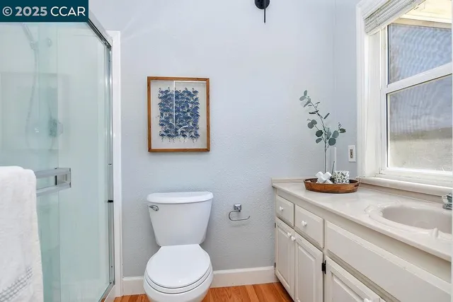 a white toilet sitting next to a bath tub