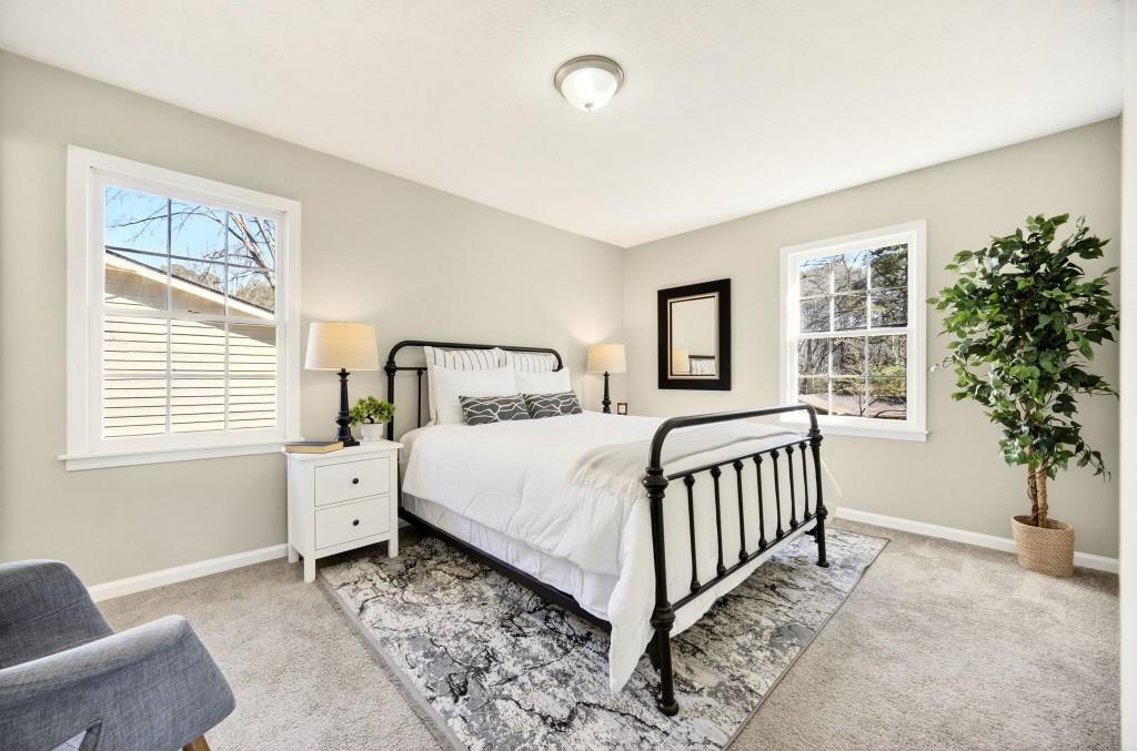 2545 Ridgecrest Drive Northwest Kennesaw, GA 30152 - Photo 12 of 20 a bedroom with a large bed and a window