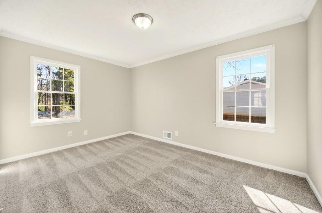 2545 Ridgecrest Drive Northwest Kennesaw, GA 30152 - Photo 16 of 20 a view of an empty room with a window