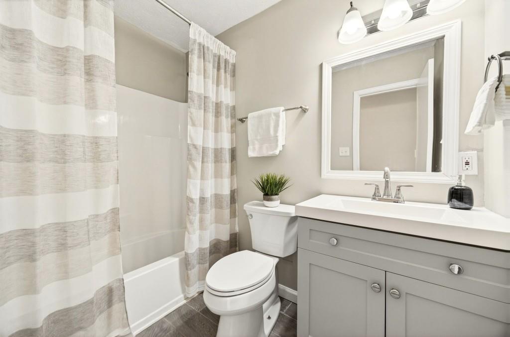 2545 Ridgecrest Drive Northwest Kennesaw, GA 30152 - Photo 17 of 20 a bathroom with a sink toilet and shower