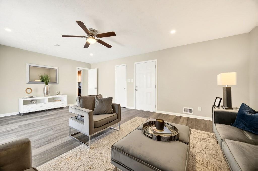 2545 Ridgecrest Drive Northwest Kennesaw, GA 30152 - Photo 5 of 20 a living room with furniture and a wooden floor
