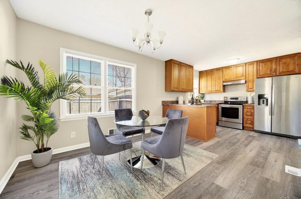 2545 Ridgecrest Drive Northwest Kennesaw, GA 30152 - Photo 7 of 20 a living room with stainless steel appliances kitchen island granite countertop furniture and a kitchen view