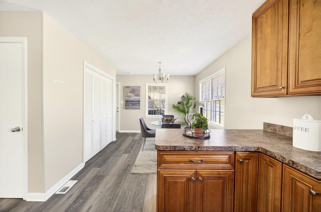 2545 Ridgecrest Drive Northwest Kennesaw, GA 30152 - Photo 9 of 20 a kitchen with stainless steel appliances granite countertop a sink stove and cabinets