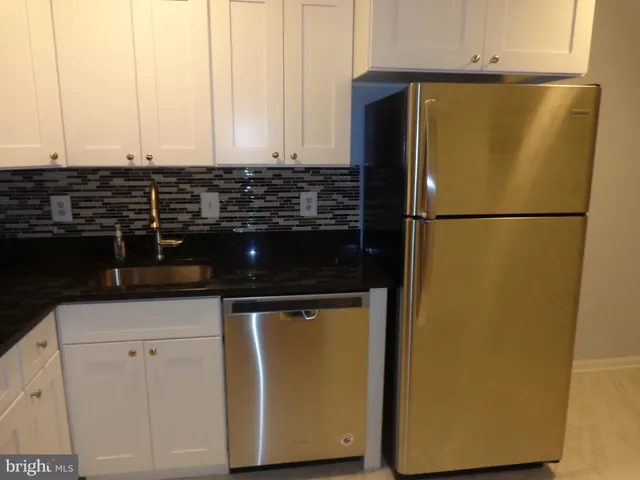 a view of a refrigerator in a kitchen