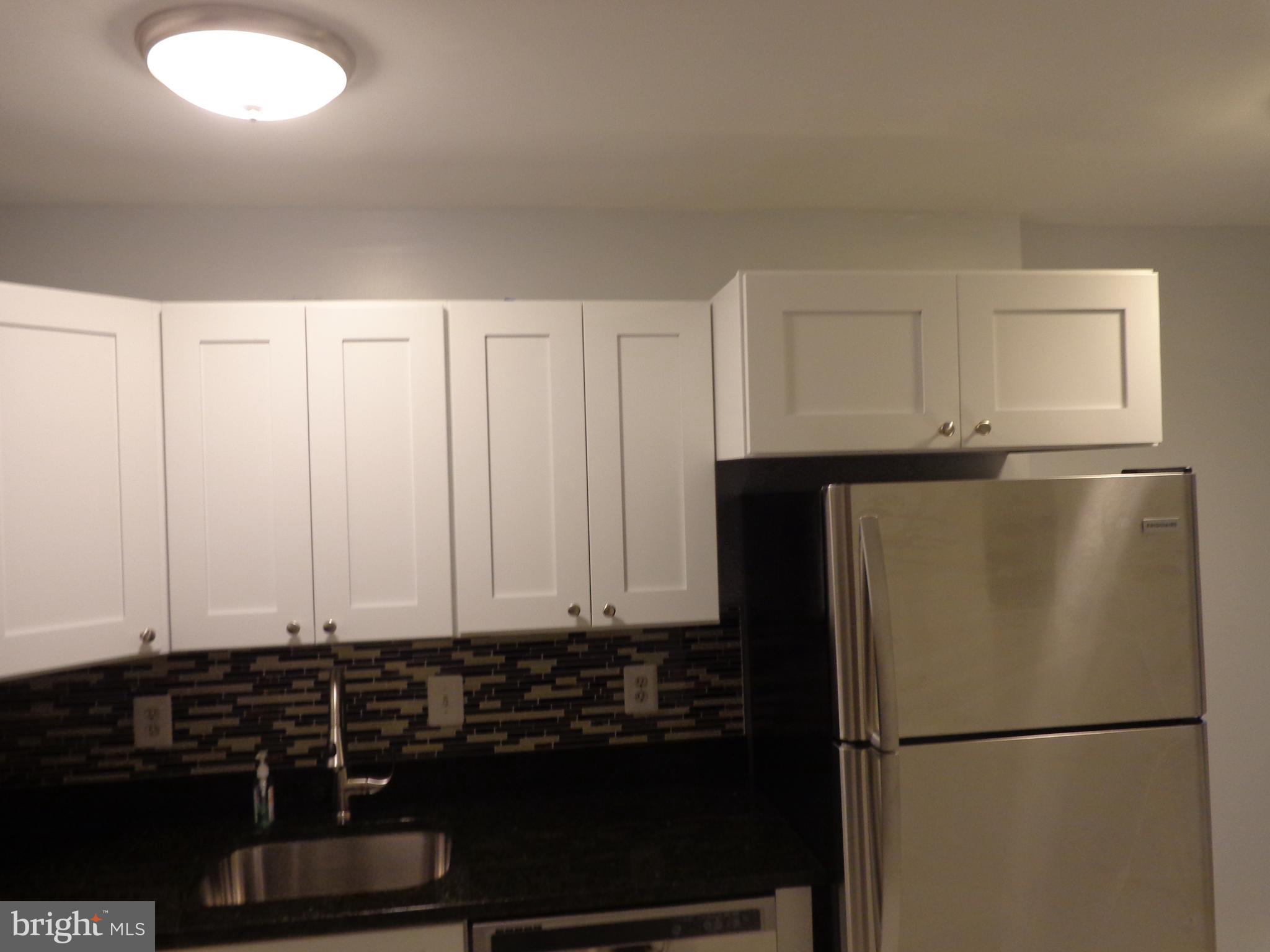 5565 Peppercorn Drive Burke, VA 22015 - Photo 18 of 41 a view of a refrigerator in a kitchen