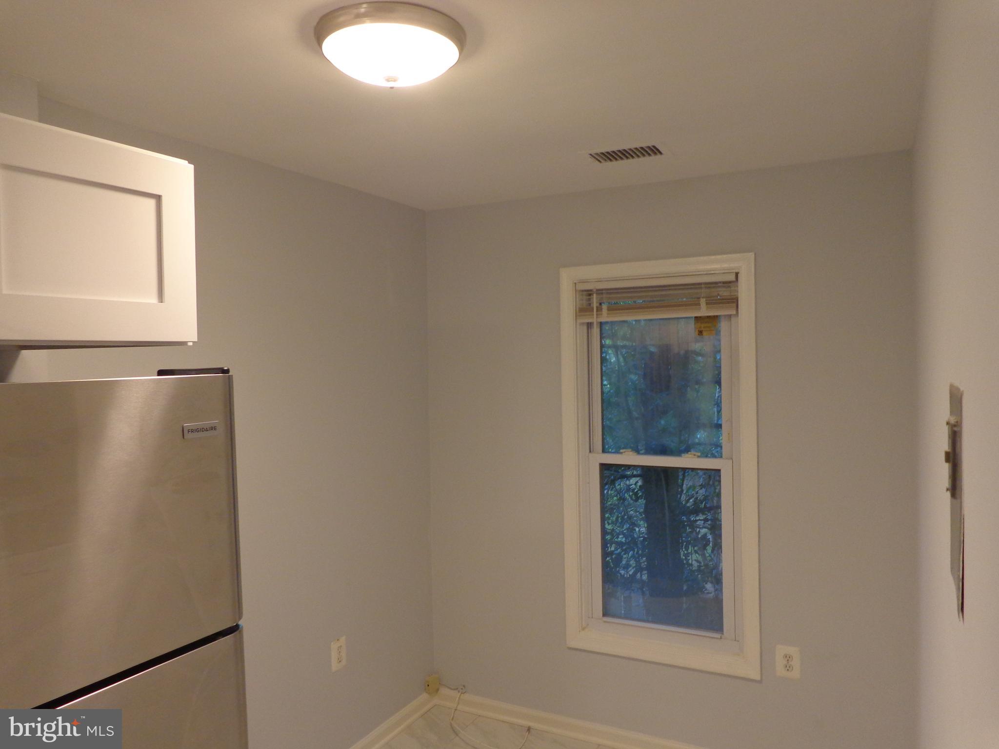 5565 Peppercorn Drive Burke, VA 22015 - Photo 19 of 41 a view of an empty room with a window