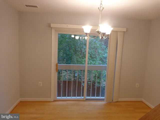 a view of a room with a large window