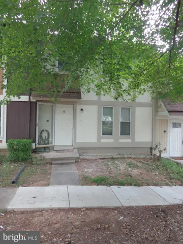 a front view of a house with yard
