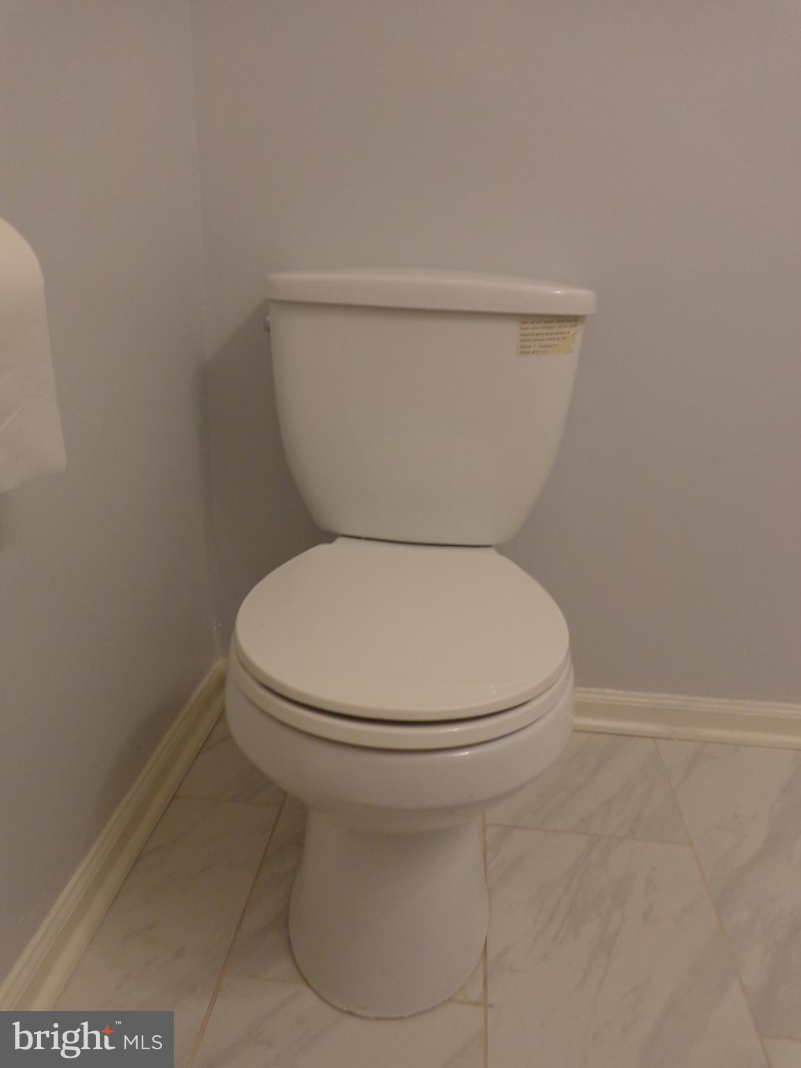 5565 Peppercorn Drive Burke, VA 22015 - Photo 24 of 41 a white toilet sitting next to a white wall