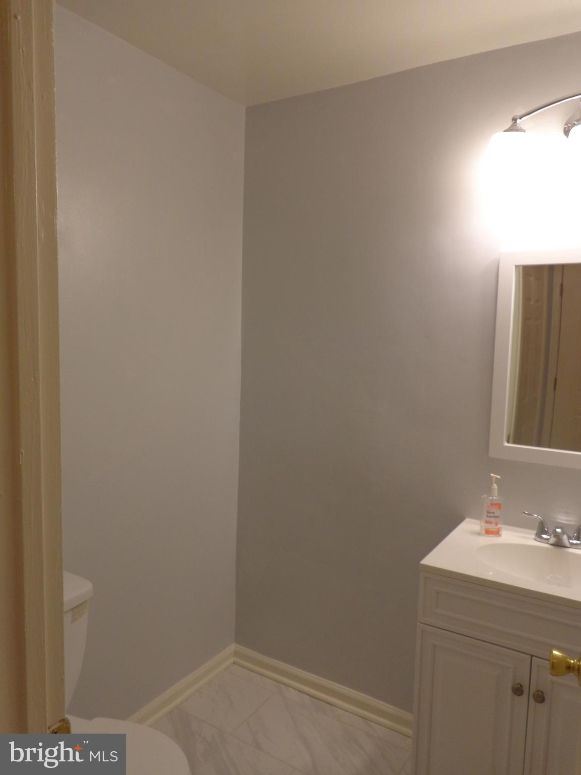 5565 Peppercorn Drive Burke, VA 22015 - Photo 25 of 41 a bathroom with a sink and vanity