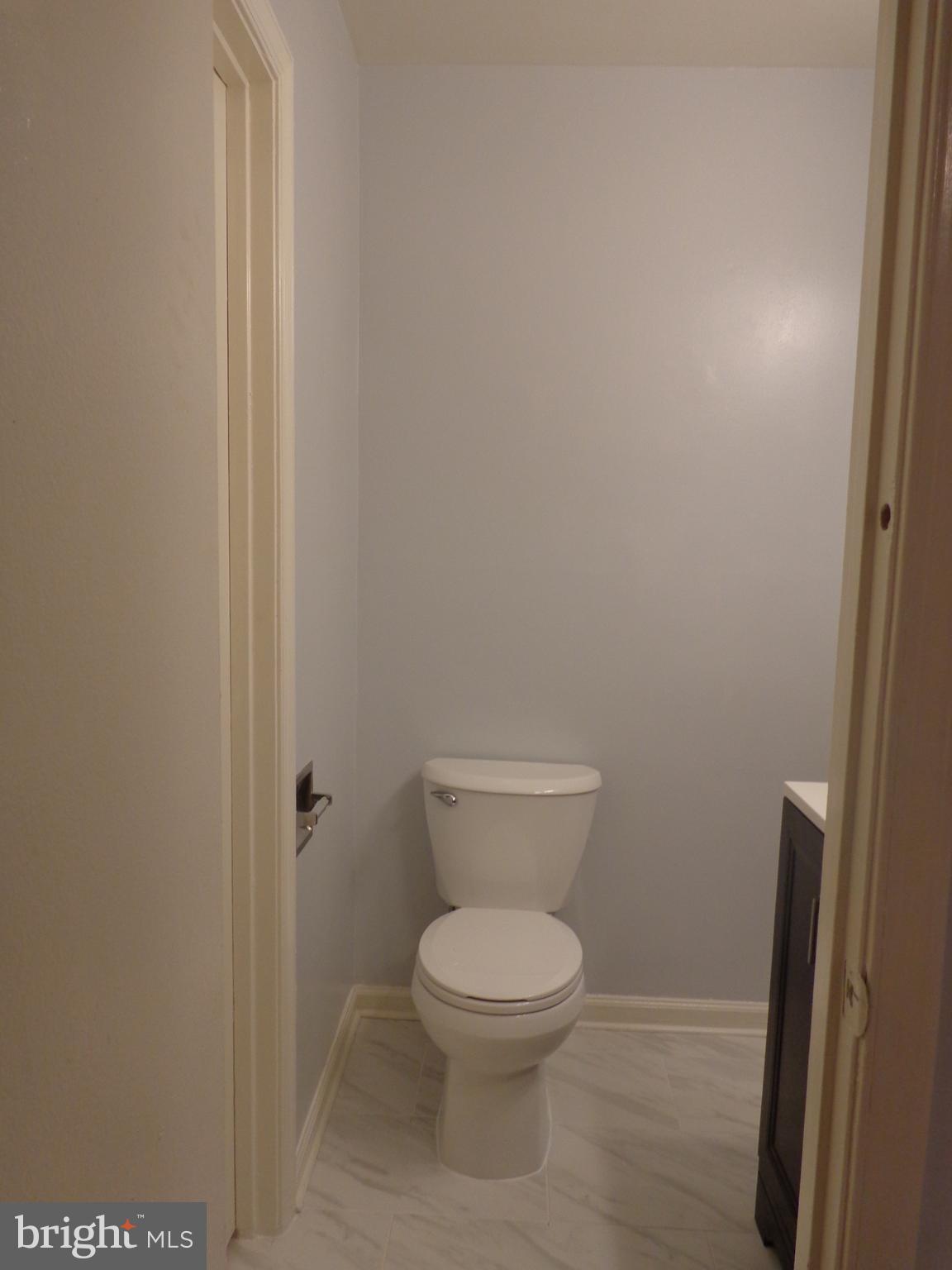 5565 Peppercorn Drive Burke, VA 22015 - Photo 28 of 41 a white toilet sitting next to a shower