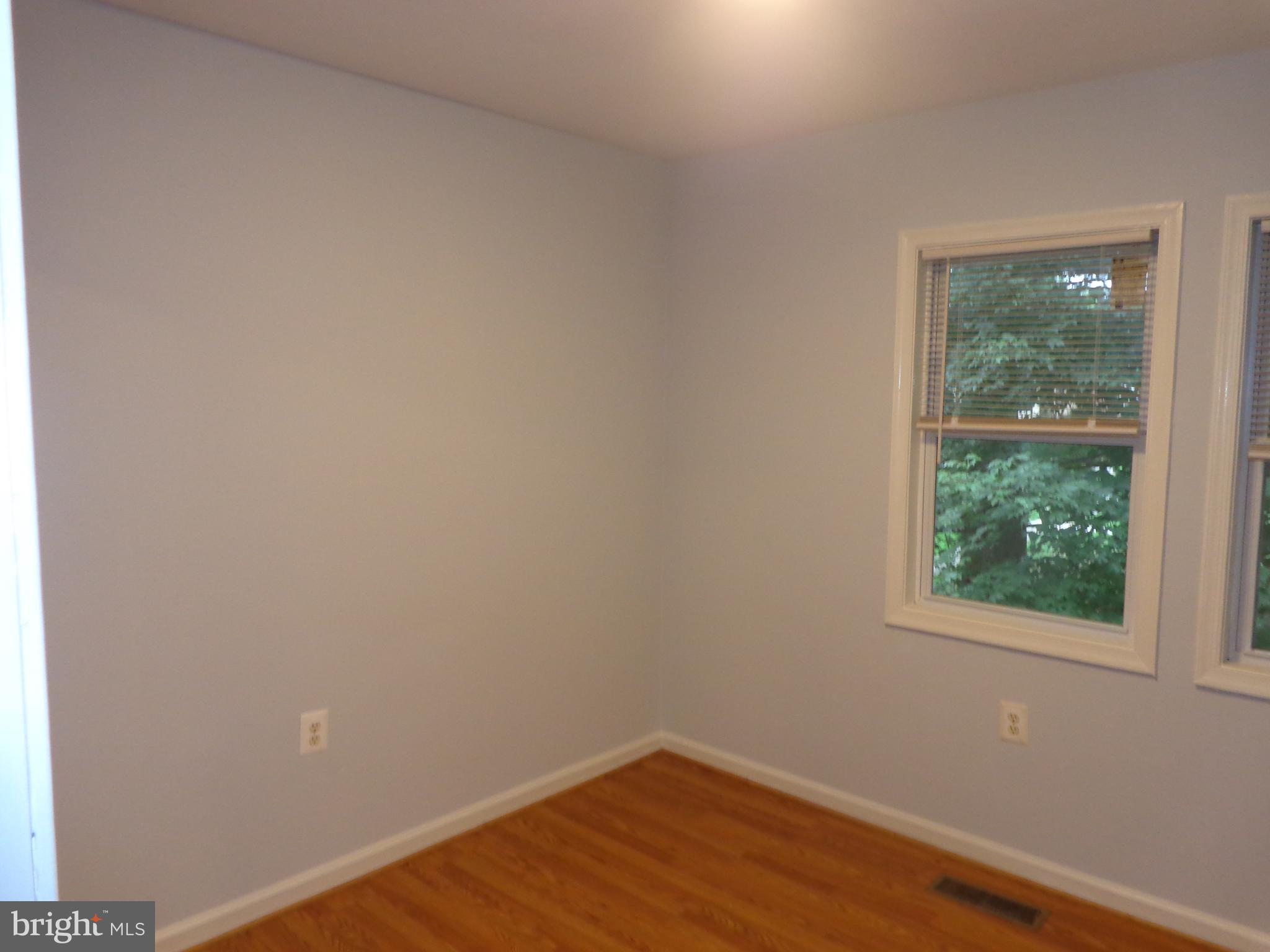 5565 Peppercorn Drive Burke, VA 22015 - Photo 35 of 41 a view of a small space with wooden floor and a window