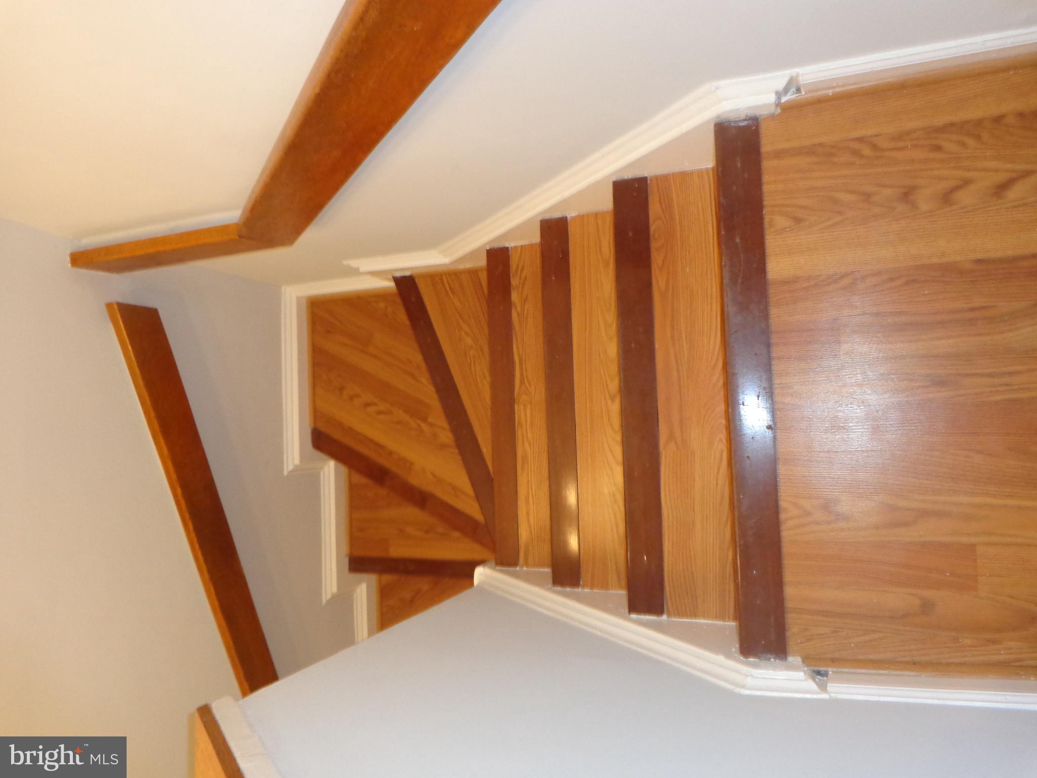 5565 Peppercorn Drive Burke, VA 22015 - Photo 37 of 41 a view of staircase with railing and white walls