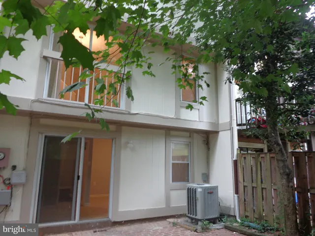 front view of a house with a tree