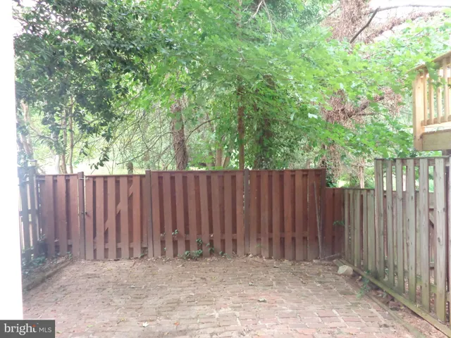 a backyard of a house with trees