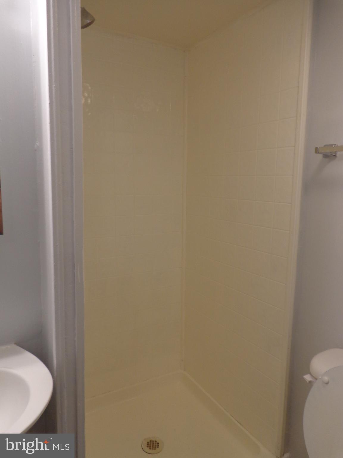 5565 Peppercorn Drive Burke, VA 22015 - Photo 8 of 41 a bathroom with a granite countertop toilet and a sink