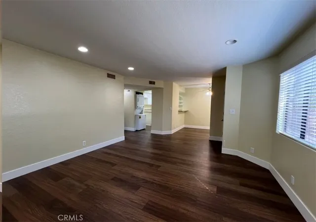 a view of a livingroom with wooden floor