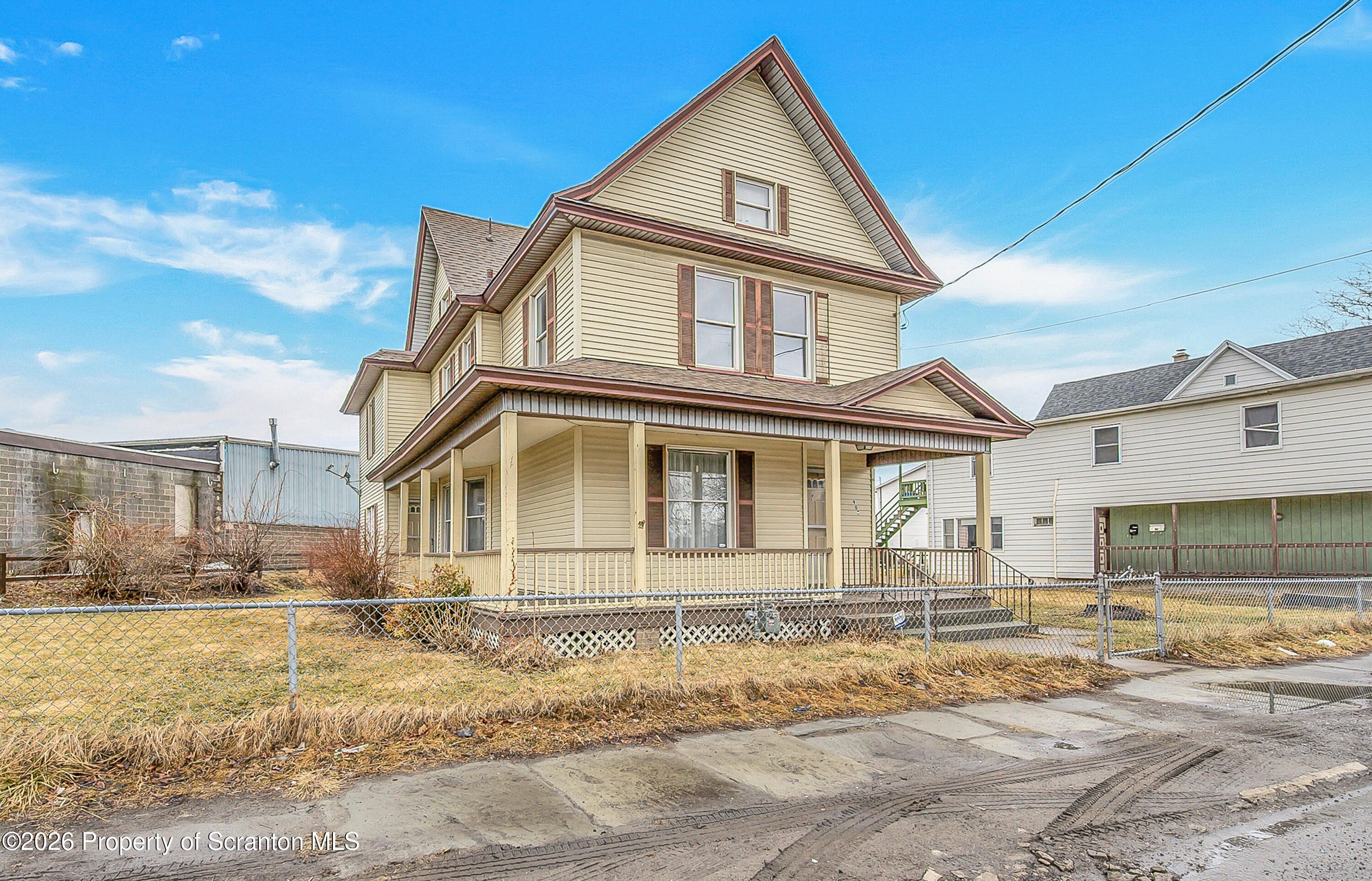 905 Albright Avenue Scranton, PA 18508 - Photo 1 of 56 a front view of a house with a yard