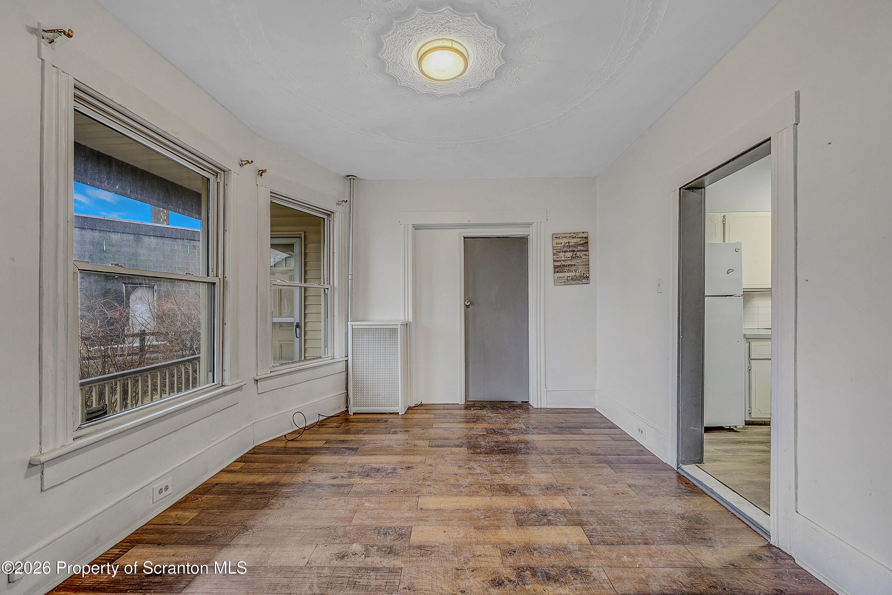 905 Albright Avenue Scranton, PA 18508 - Photo 30 of 56 a view of an empty room with window and wooden floor