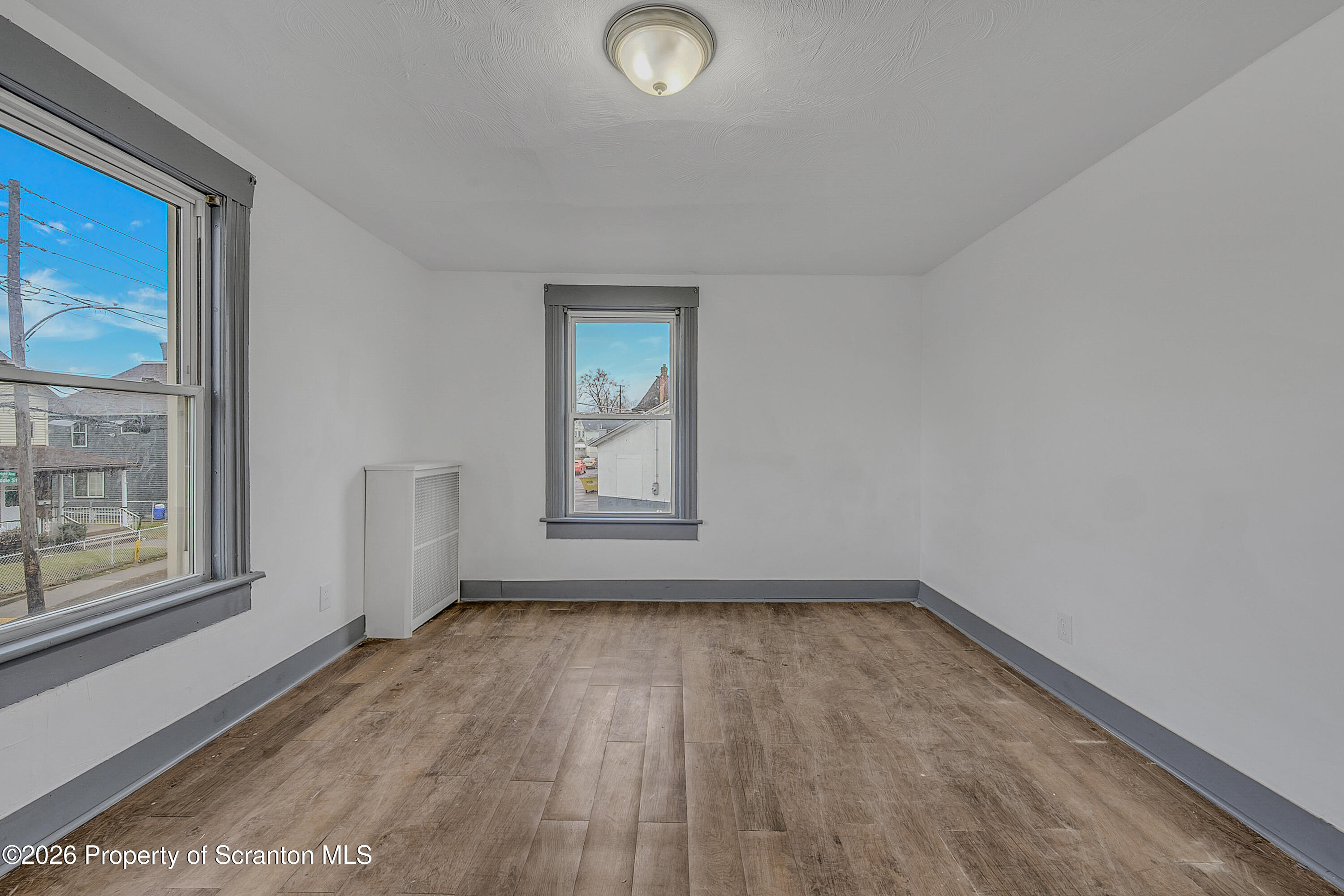 905 Albright Avenue Scranton, PA 18508 - Photo 31 of 56 a view of empty room with wooden floor and fan