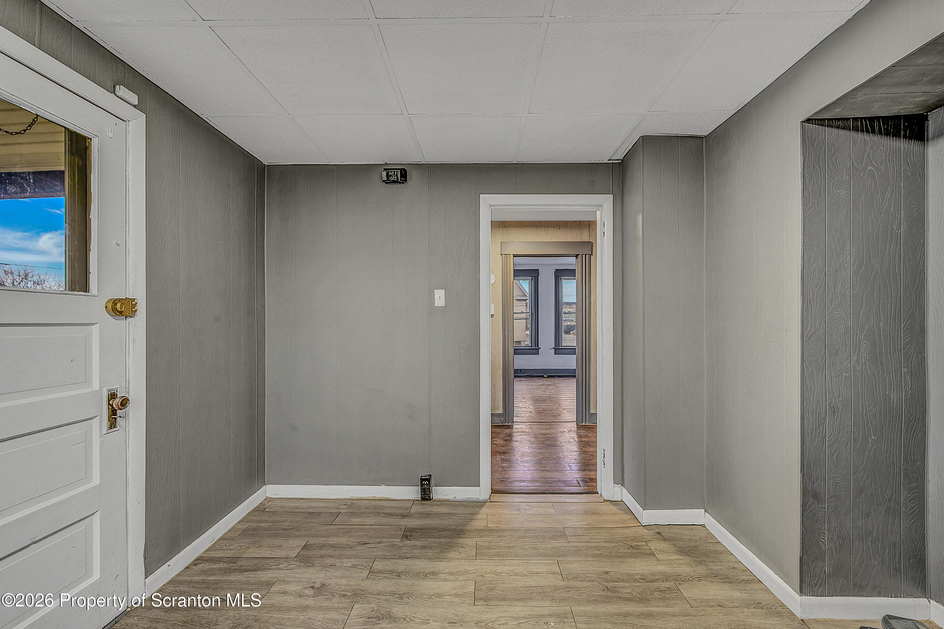 905 Albright Avenue Scranton, PA 18508 - Photo 38 of 56 a view of an empty room with wooden floor and a window