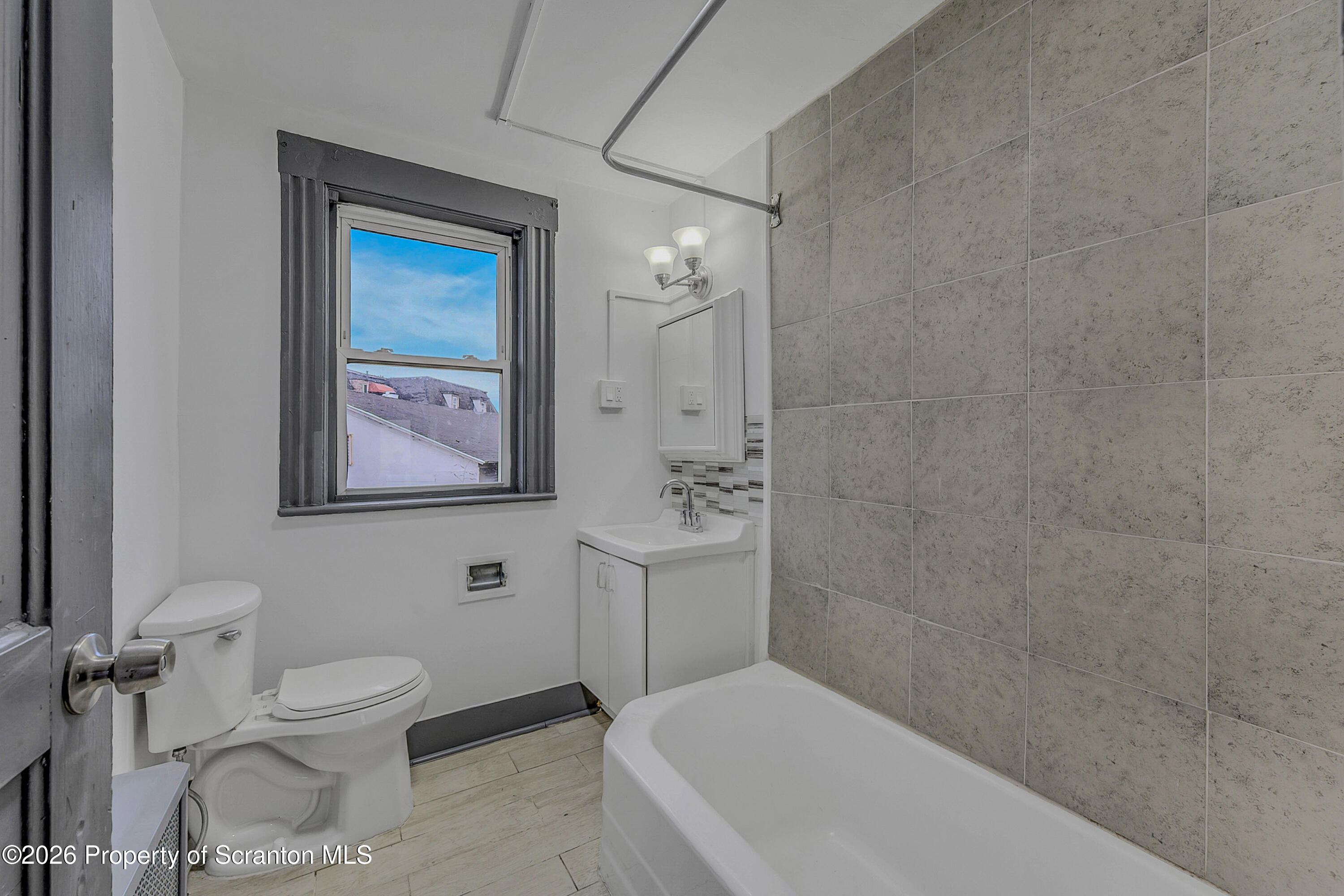 905 Albright Avenue Scranton, PA 18508 - Photo 39 of 56 a bathroom with a toilet a sink and mirror