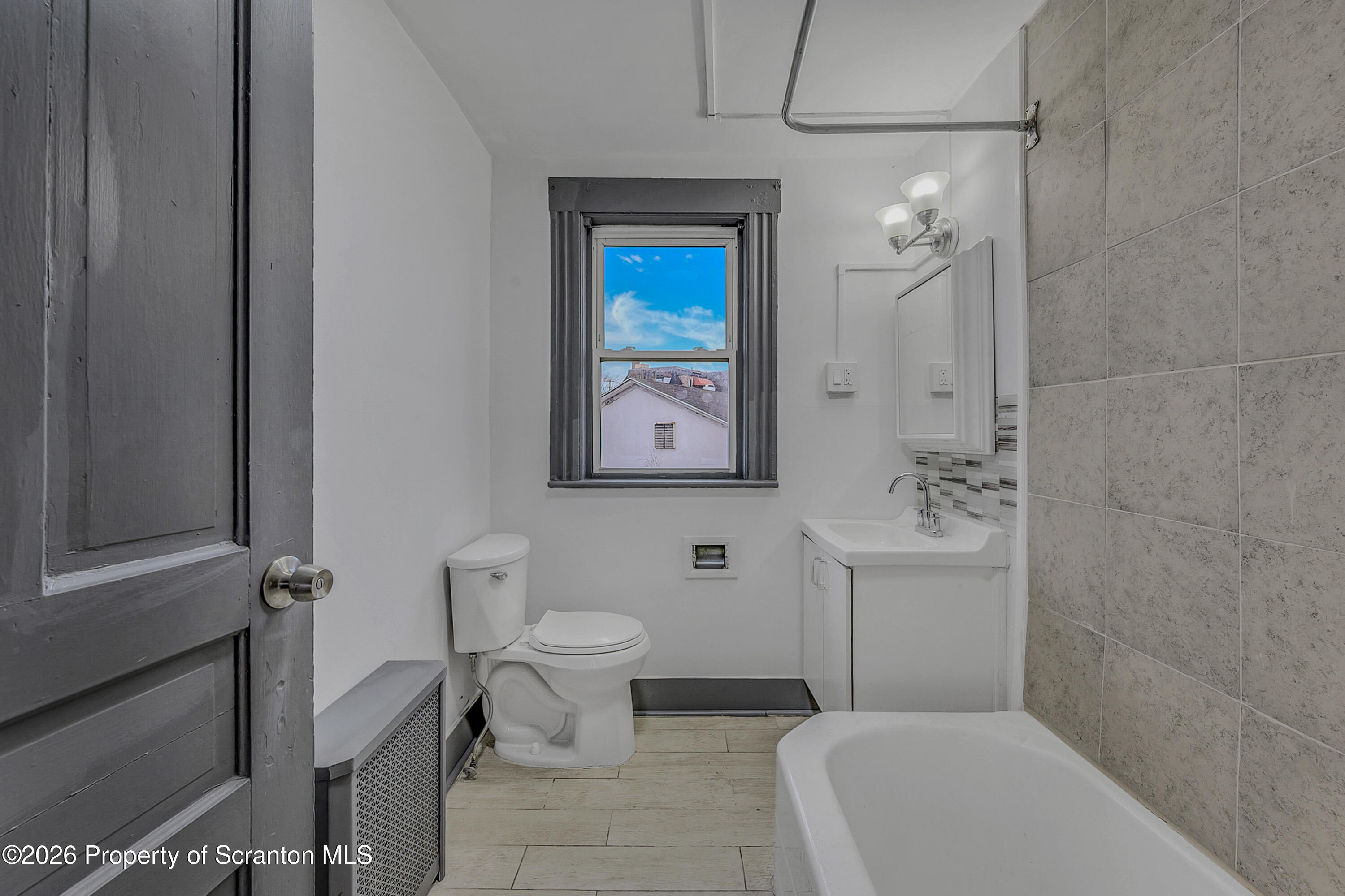 905 Albright Avenue Scranton, PA 18508 - Photo 40 of 56 a bathroom with a toilet a sink and mirror