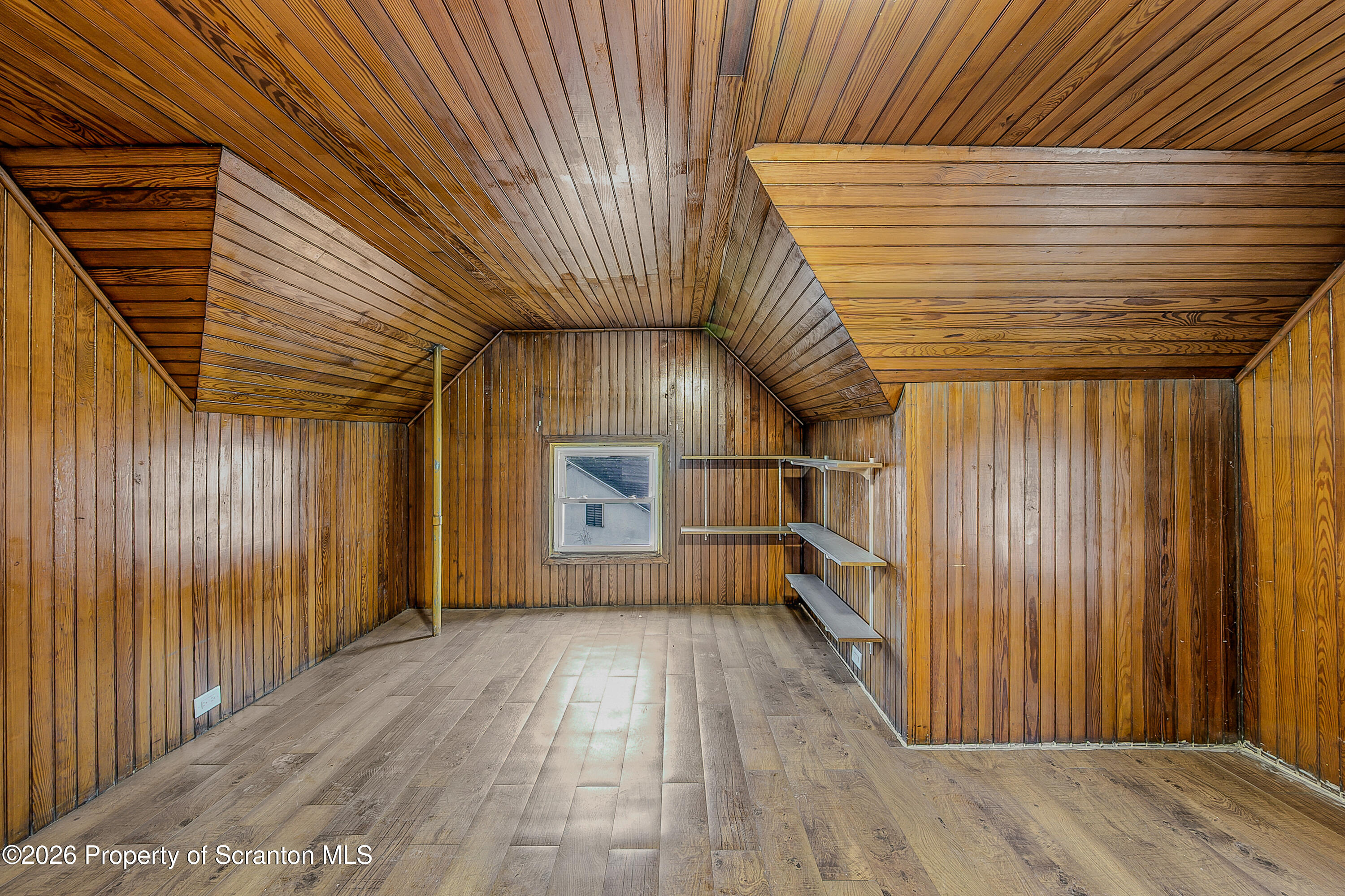 905 Albright Avenue Scranton, PA 18508 - Photo 41 of 56 an empty room with wooden floor and windows
