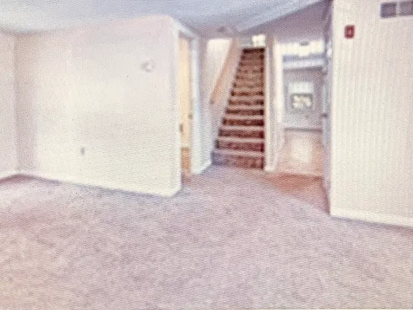 a view of a hallway with staircase