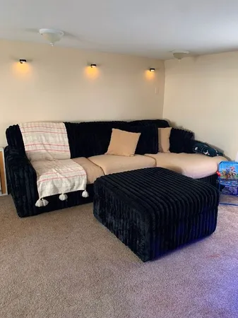 a bedroom with a bed and lamp