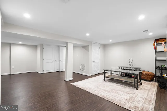 a view of an empty room and wooden floor