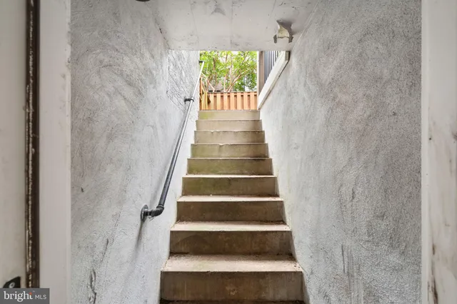 a view of a house with backyard porch and sitting area