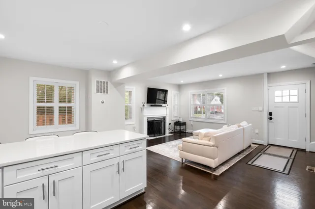 a spacious bedroom with a bed and a large window