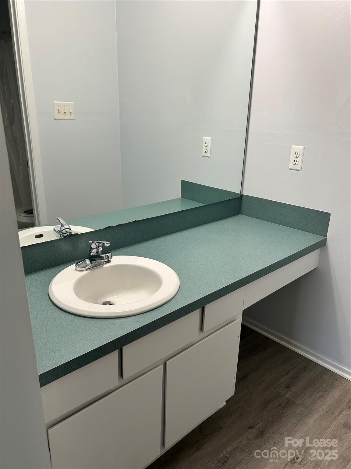 4936 Sardis Road, Unit A Charlotte, NC 28270 - Photo 15 of 21 a bathroom with a sink and a mirror